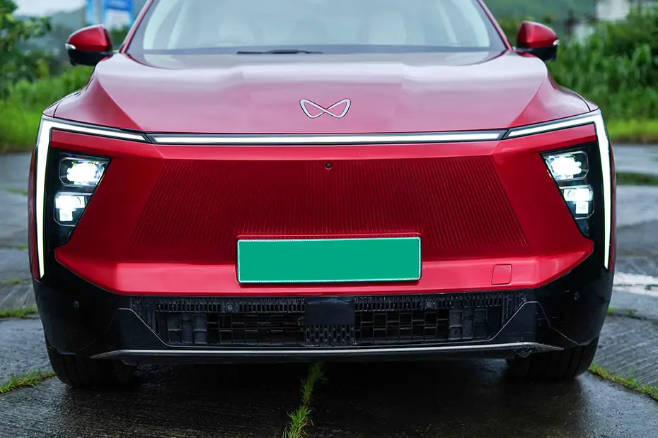 Mahindra XEV 9e Pack One front profile in red at dealership
