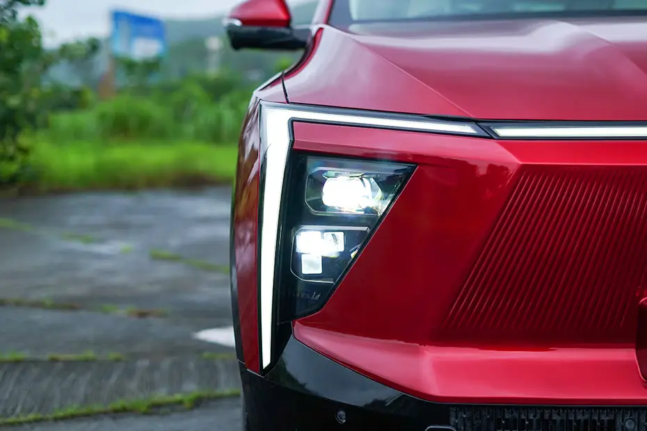 Mahindra XEV 9e Pack One front profile in red at dealership